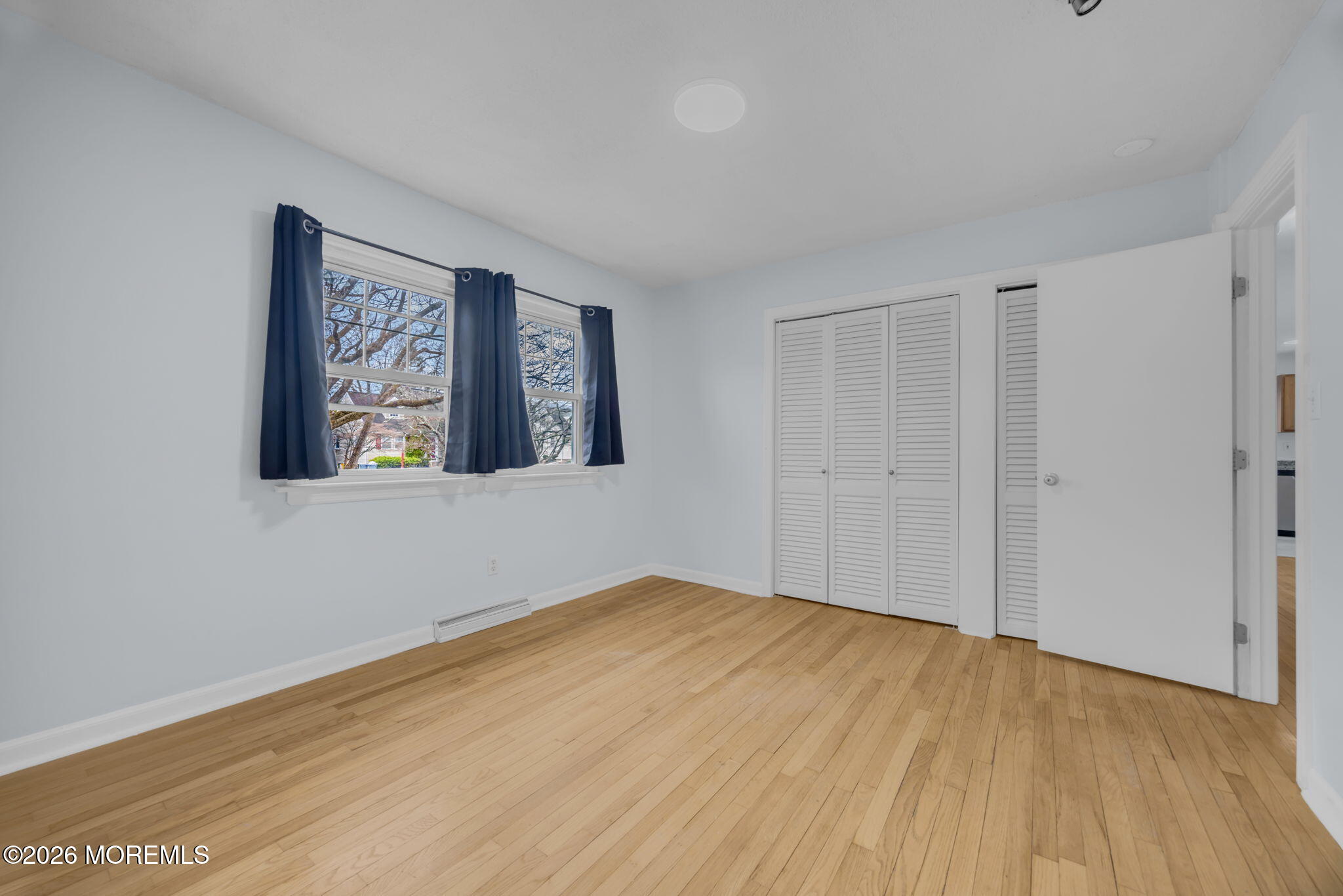 108 Susan Drive Ewing, NJ 08638 - Photo 21 of 40 a view of an empty room with wooden floor