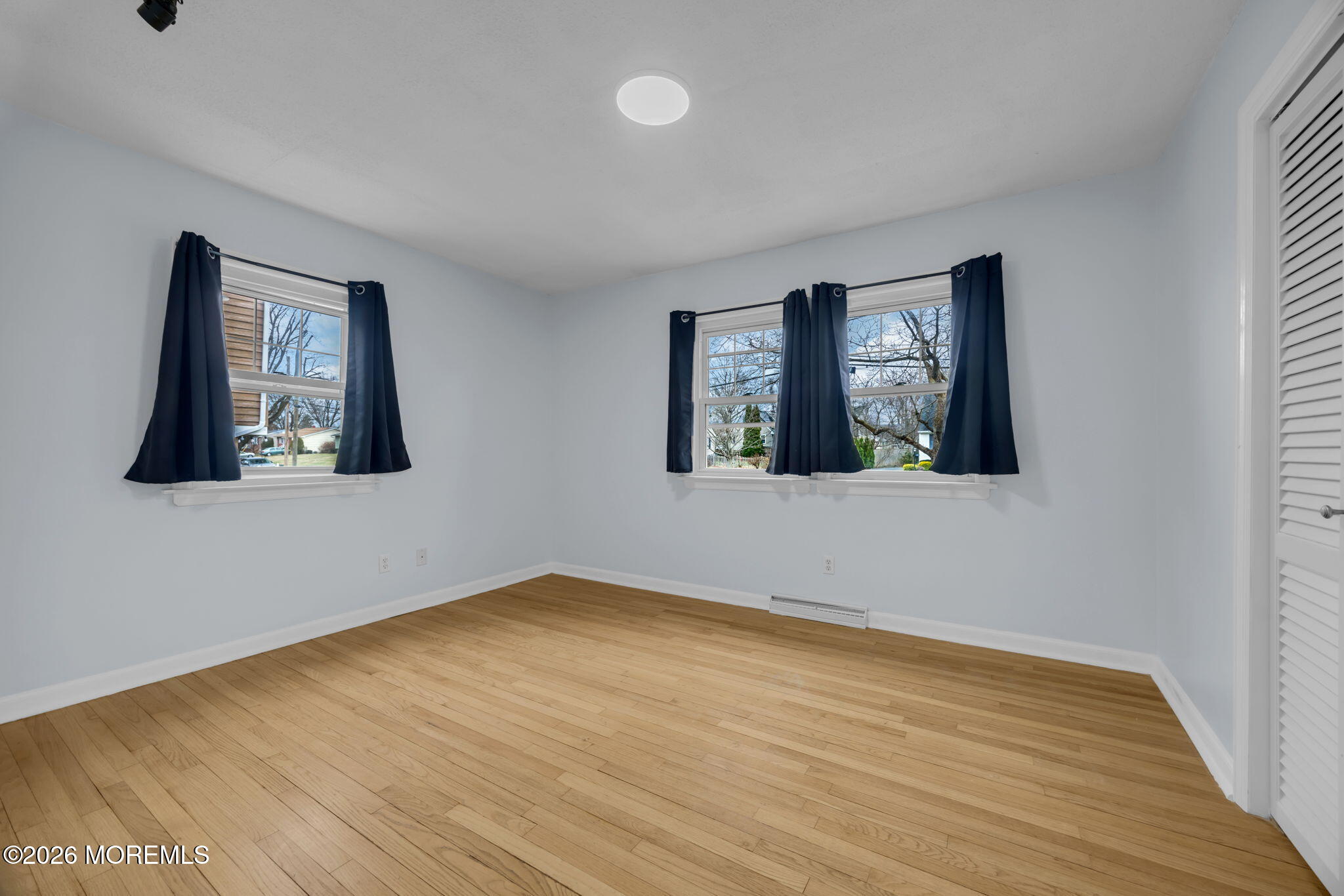 108 Susan Drive Ewing, NJ 08638 - Photo 22 of 40 a view of an empty room with wooden floor and a window
