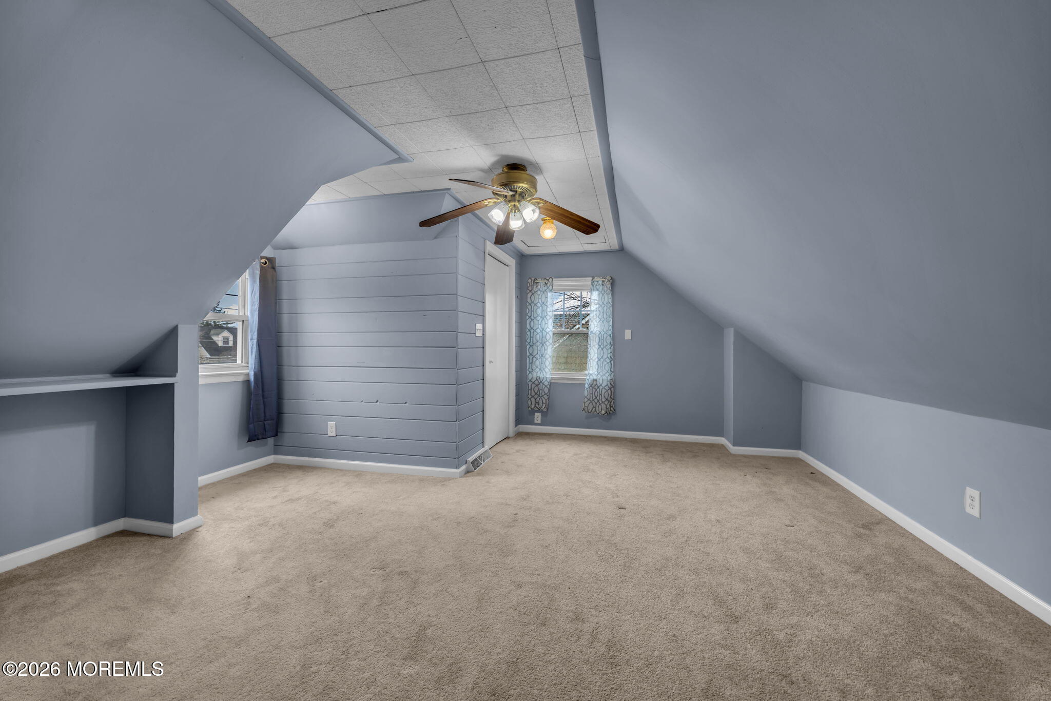 108 Susan Drive Ewing, NJ 08638 - Photo 29 of 40 an empty room with a chandelier fan and windows