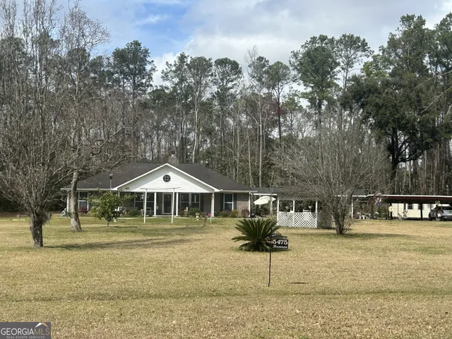 a front view of a building with garden