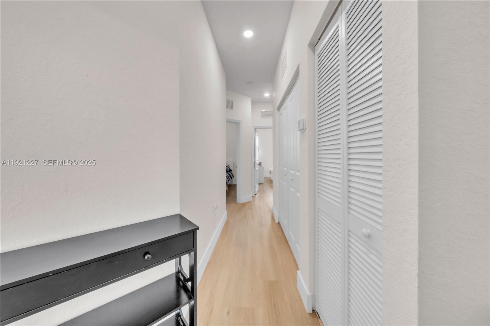 12917 Northwest 23rd Place Miami, FL 33147 - Photo 18 of 43 a view of a hallway with closet