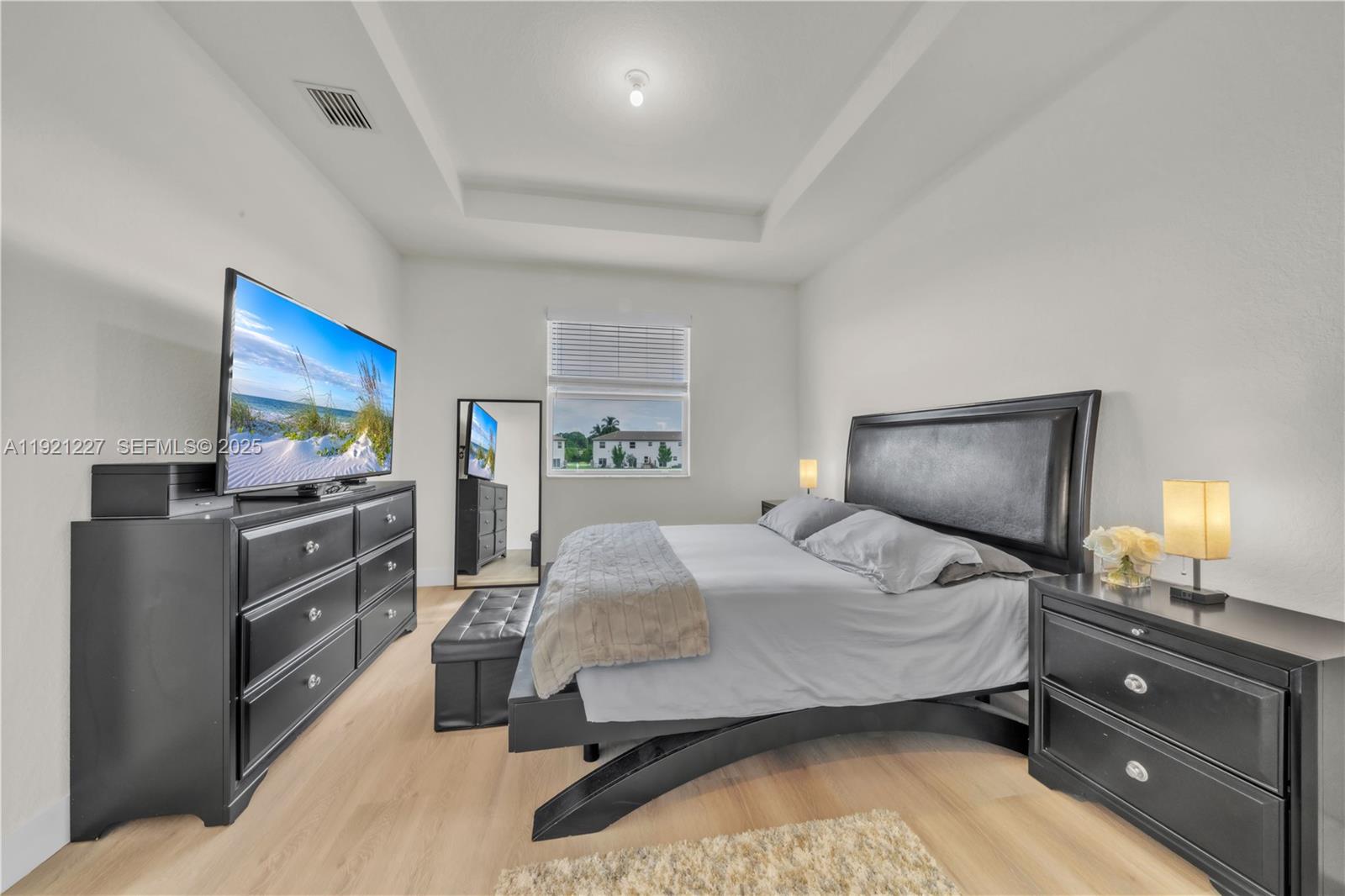 12917 Northwest 23rd Place Miami, FL 33147 - Photo 20 of 43 a bedroom with a bed and furniture