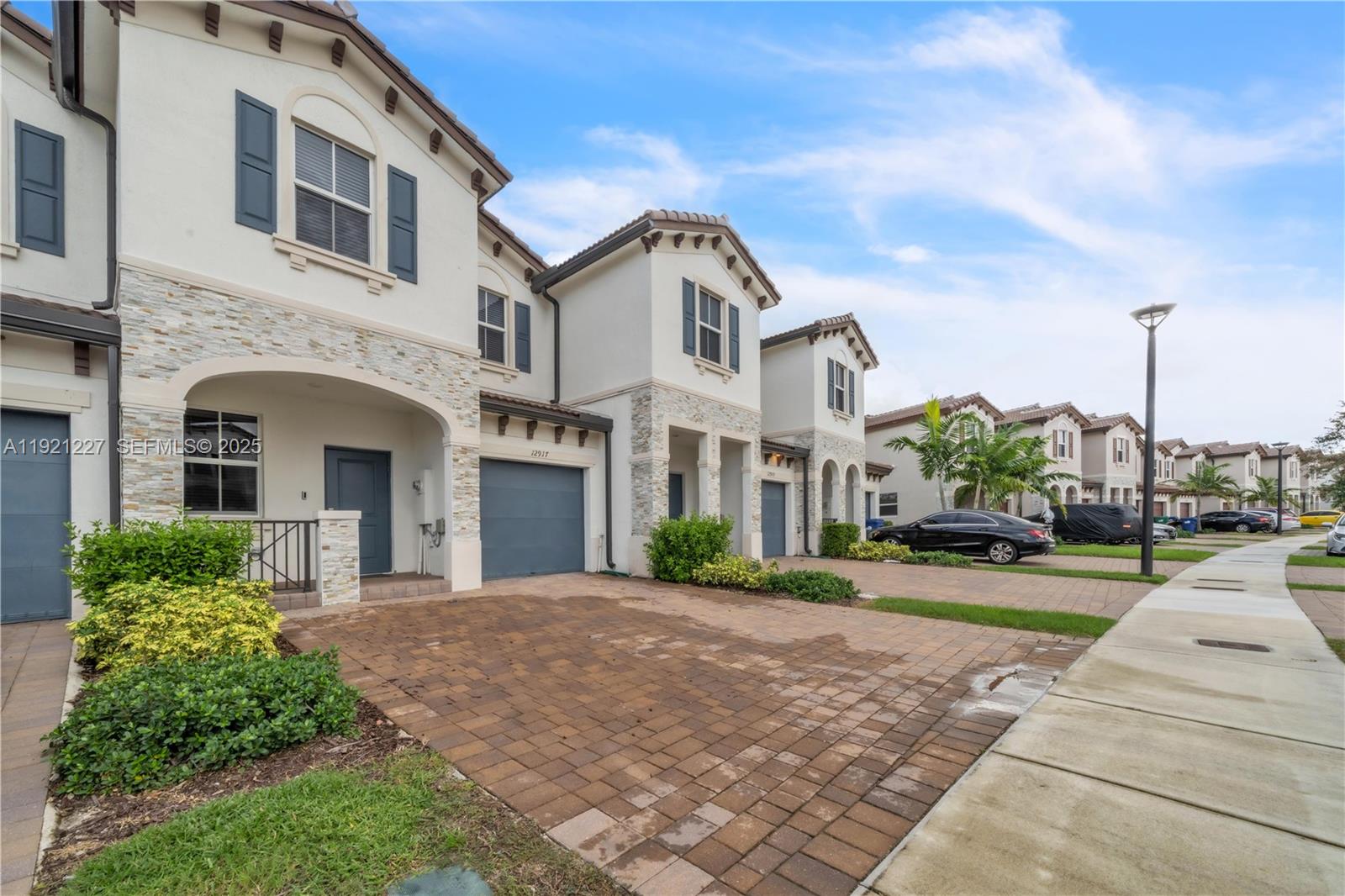 12917 Northwest 23rd Place Miami, FL 33147 - Photo 2 of 43 a front view of a residential houses with yard