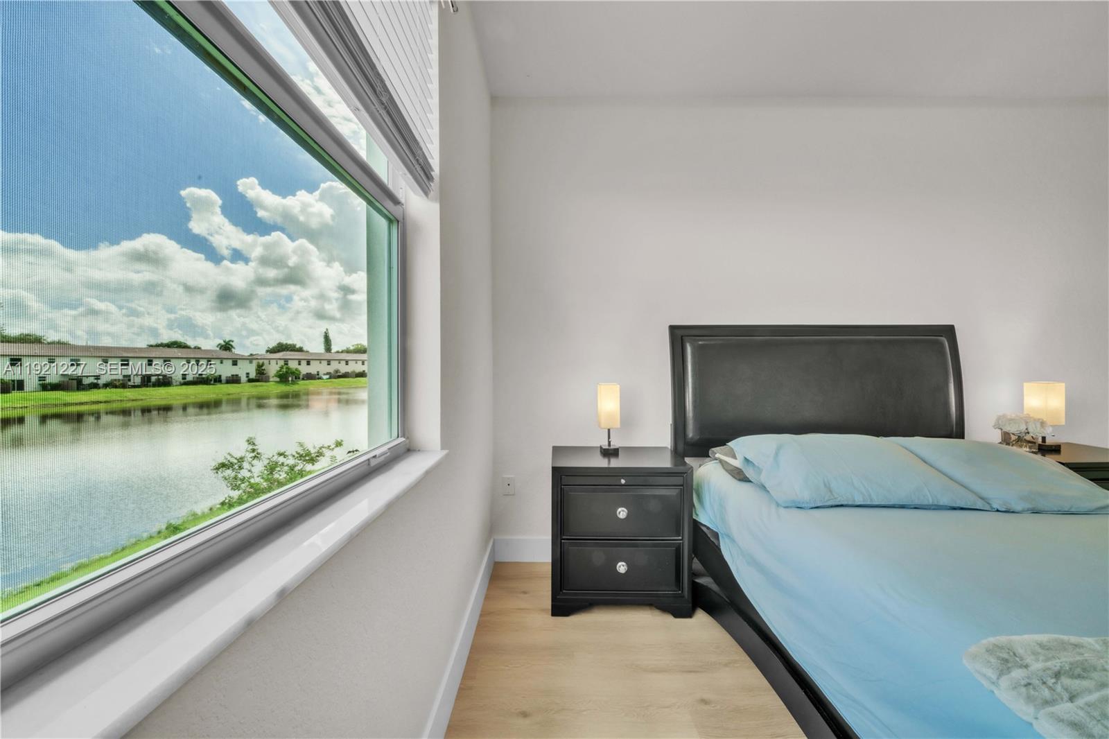 12917 Northwest 23rd Place Miami, FL 33147 - Photo 21 of 43 a bedroom with a bed and window