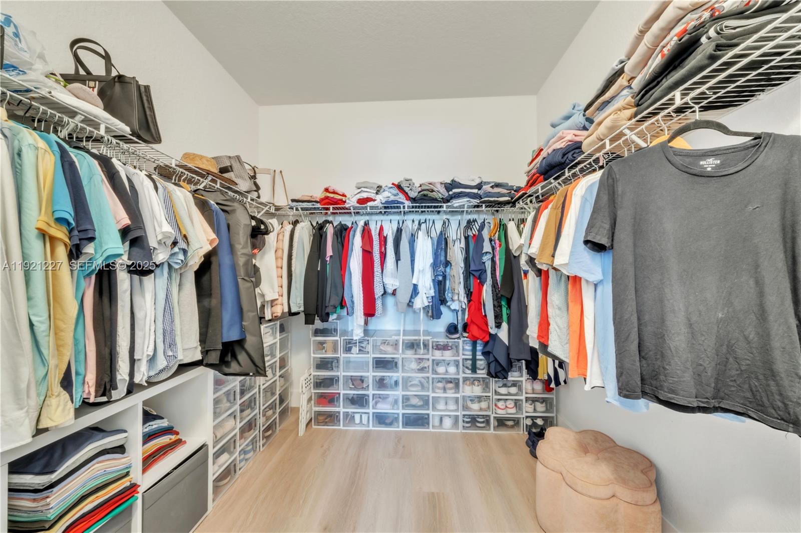 12917 Northwest 23rd Place Miami, FL 33147 - Photo 23 of 43 a view of walk in closet with clothes