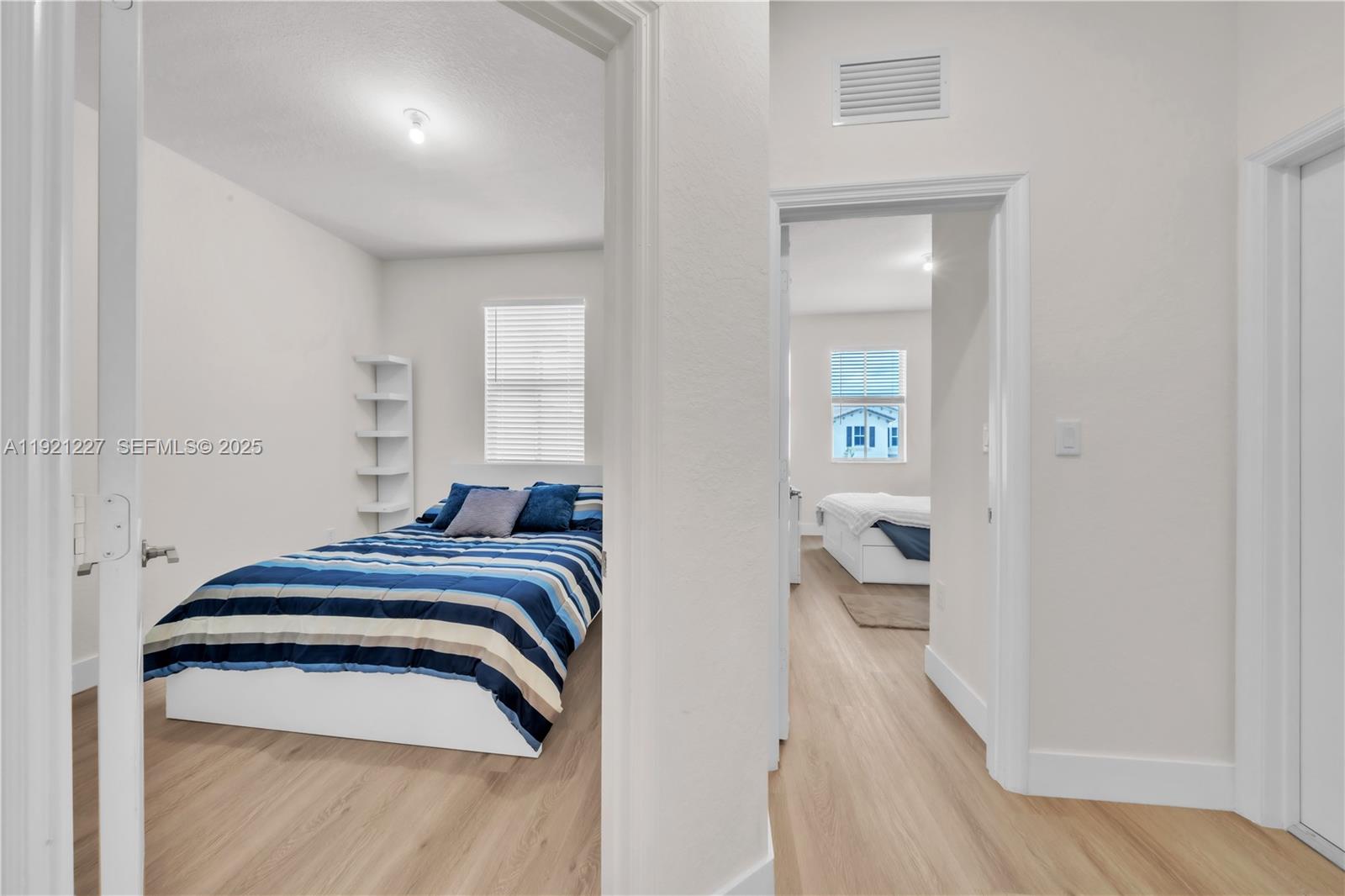 12917 Northwest 23rd Place Miami, FL 33147 - Photo 25 of 43 a view of bedroom with wooden floor