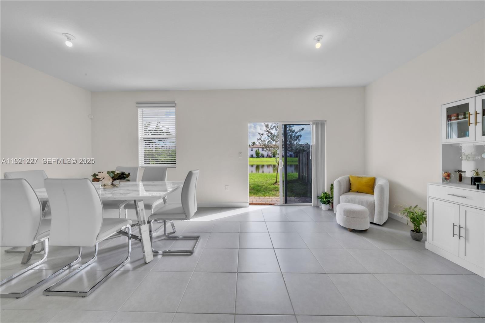 12917 Northwest 23rd Place Miami, FL 33147 - Photo 3 of 43 a living room with furniture and next to a window