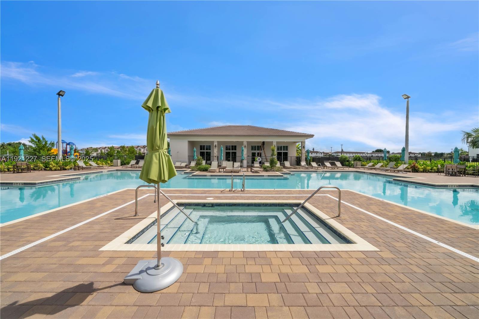 12917 Northwest 23rd Place Miami, FL 33147 - Photo 36 of 43 a swimming pool with outdoor seating and yard