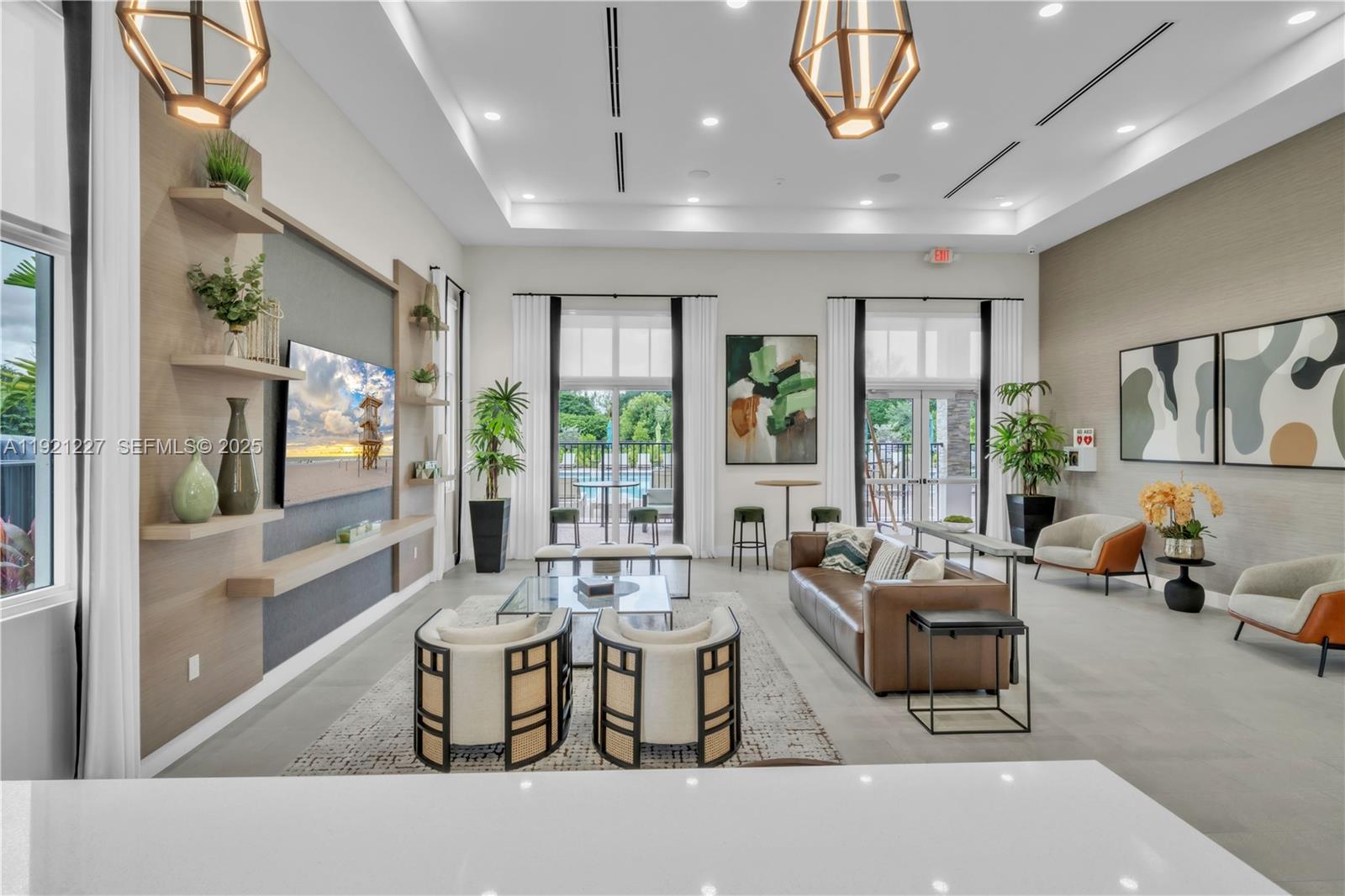 12917 Northwest 23rd Place Miami, FL 33147 - Photo 40 of 43 a living room with furniture and large windows