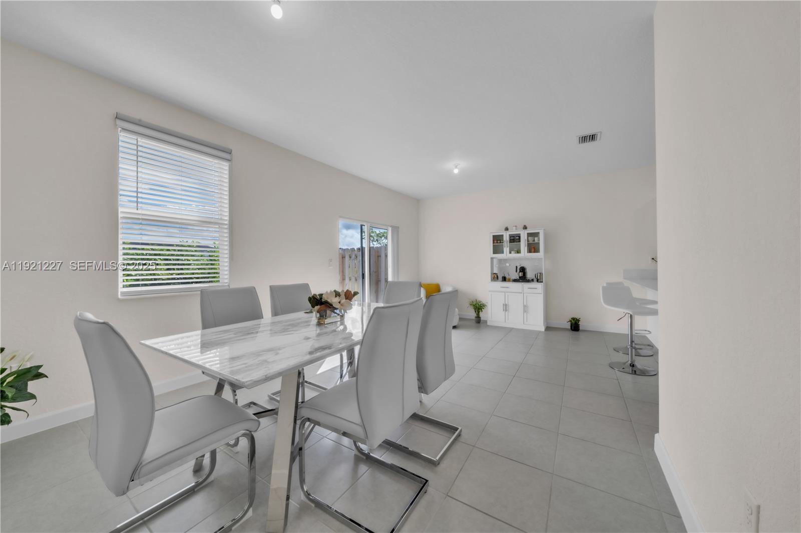 12917 Northwest 23rd Place Miami, FL 33147 - Photo 4 of 43 a view of a dining room with furniture