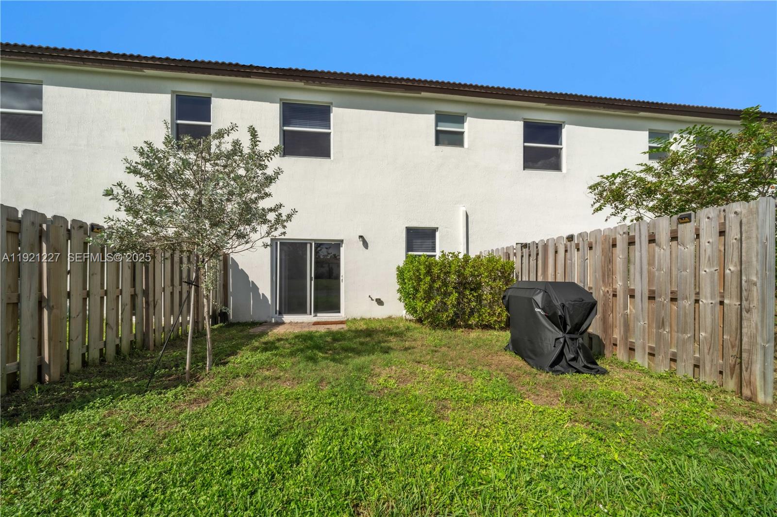 12917 Northwest 23rd Place Miami, FL 33147 - Photo 7 of 43 a view of a house with backyard and sitting area