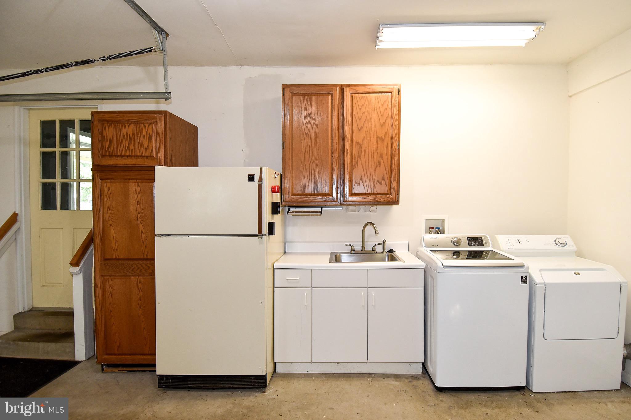 5017 Powell Road Fairfax, VA 22032 - Photo 47 of 53 Garage with Second Washer/Dryer and Refrigerator