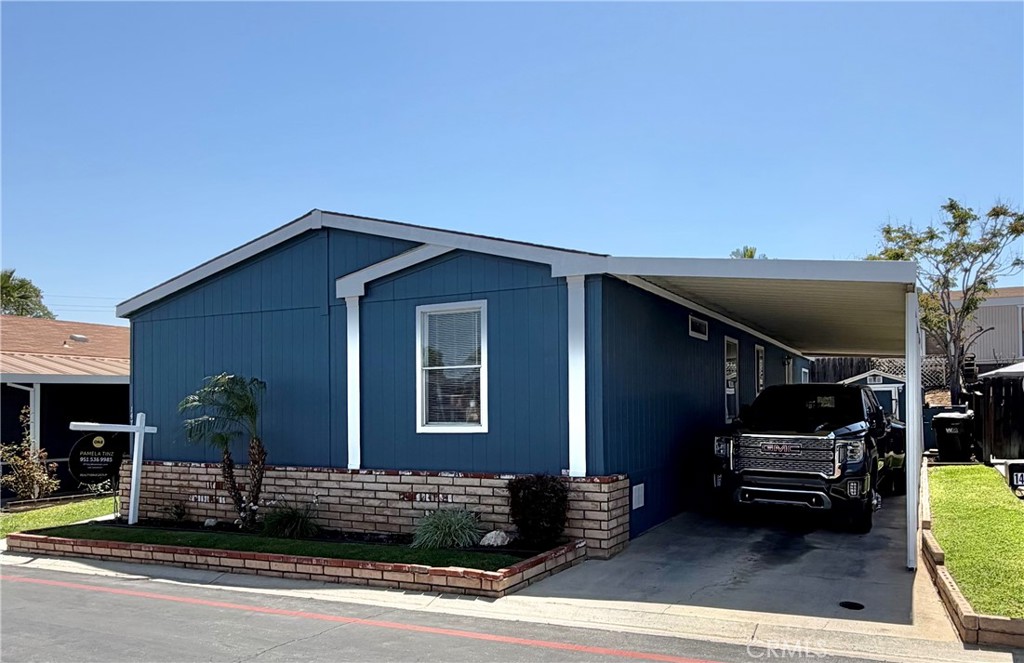 1550 Rimpau, Unit 147 Corona, CA 92881 - Photo 11 of 17 a front view of a house with garage