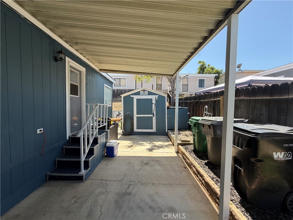 1550 Rimpau, Unit 147 Corona, CA 92881 - Photo 13 of 17 a view of outdoor space and barbecue grill
