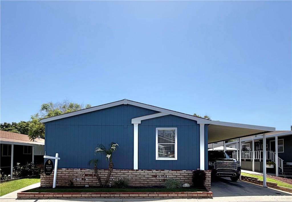 1550 Rimpau, Unit 147 Corona, CA 92881 - Photo 2 of 17 a front view of a house with balcony