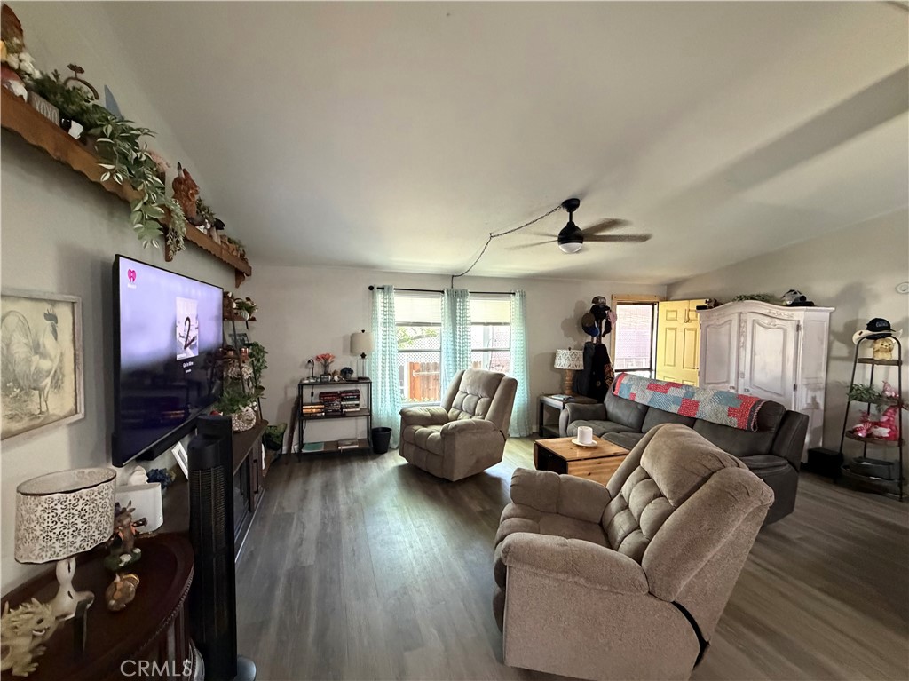 1550 Rimpau, Unit 147 Corona, CA 92881 - Photo 5 of 17 a living room with furniture and a flat screen tv