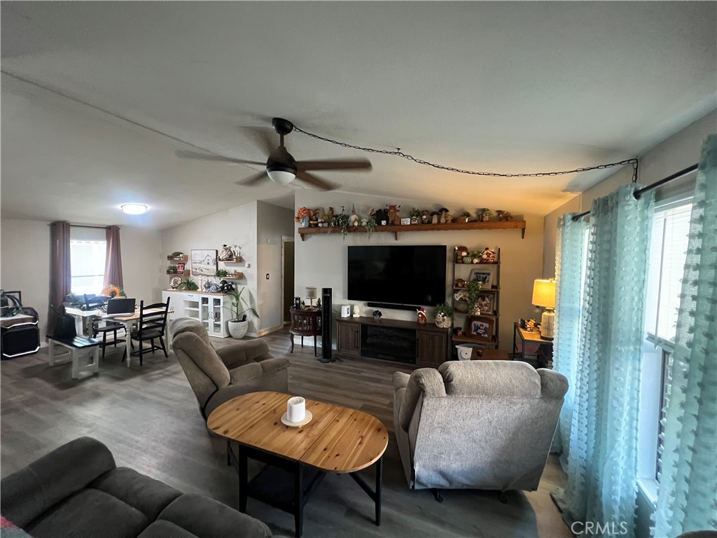 1550 Rimpau, Unit 147 Corona, CA 92881 - Photo 6 of 17 a living room with furniture and a flat screen tv