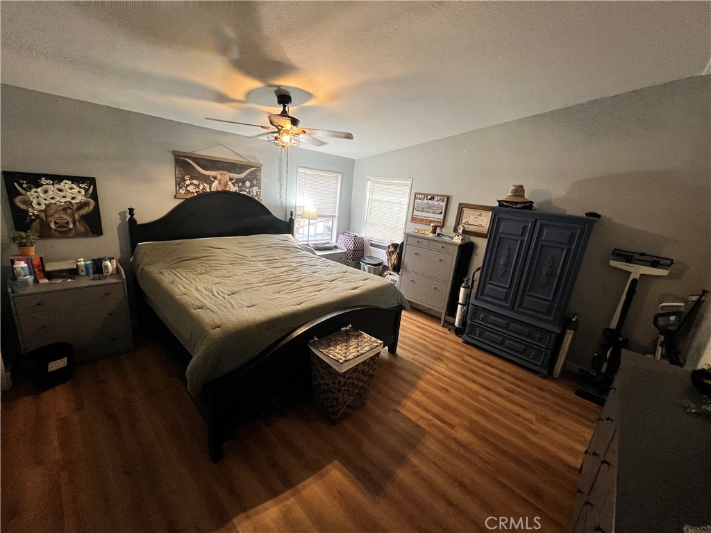 1550 Rimpau, Unit 147 Corona, CA 92881 - Photo 8 of 17 a living room with furniture and wooden floor