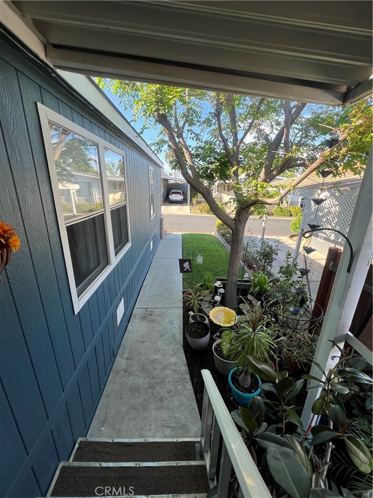 1550 Rimpau, Unit 147 Corona, CA 92881 - Photo 9 of 17 a view of a room with wooden floor and outdoor space