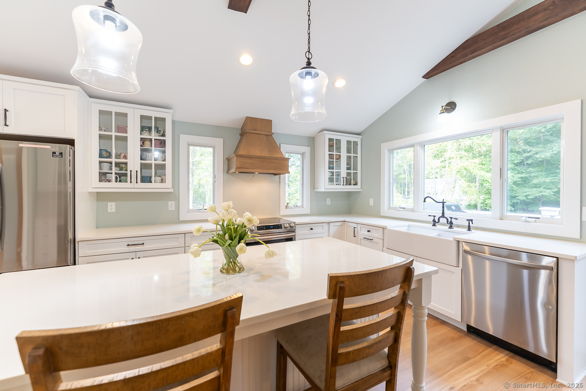 147 Pequot Avenue Groton, CT 06355 - Photo 12 of 40 Center island with quartz counters and casual seating for that morning cup of coffee.