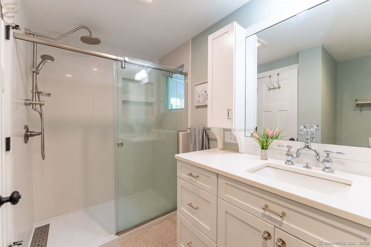 147 Pequot Avenue Groton, CT 06355 - Photo 25 of 40 Primary bedroom with low profile shower for easy access.