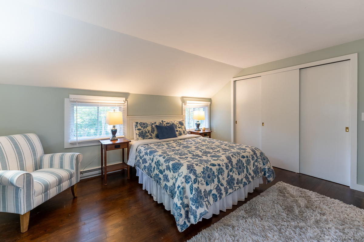 147 Pequot Avenue Groton, CT 06355 - Photo 27 of 40 Double closets and hardwood flooring access this bedroom on the upper level.