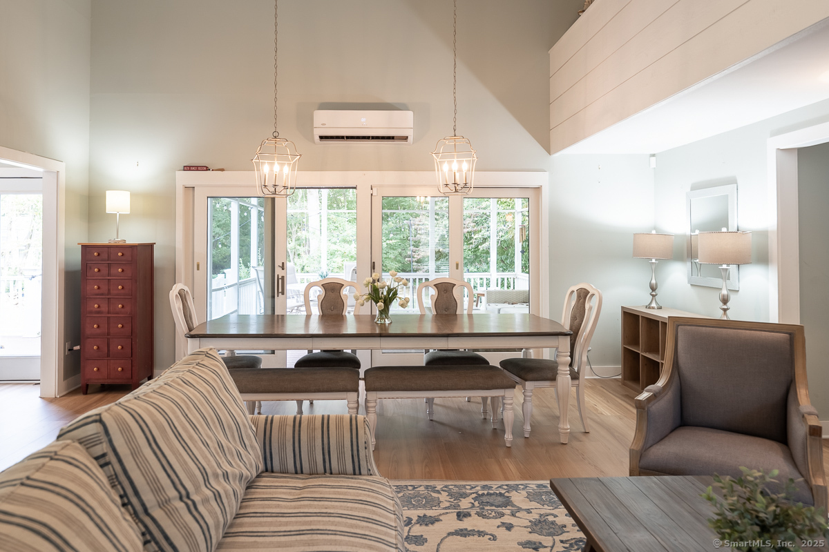 147 Pequot Avenue Groton, CT 06355 - Photo 40 of 40 Living room open floor plan with dining area and sliding doors to outdoor patio space ideal for entertaining.