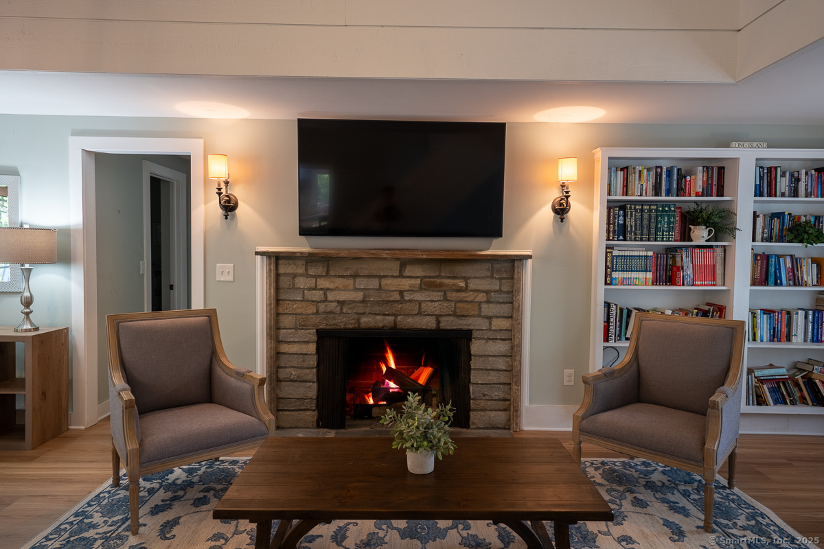147 Pequot Avenue Groton, CT 06355 - Photo 8 of 40 Wood burning fireplace with natural stone in the living room on main level.