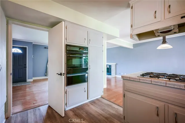 a kitchen with stainless steel appliances a stove and a refrigerator