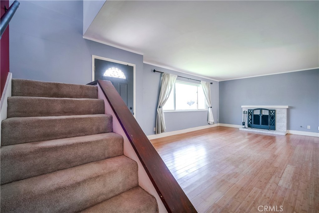 6473 Capistrano Way Riverside, CA 92504 - Photo 15 of 28 a view of empty room with wooden floor and fan