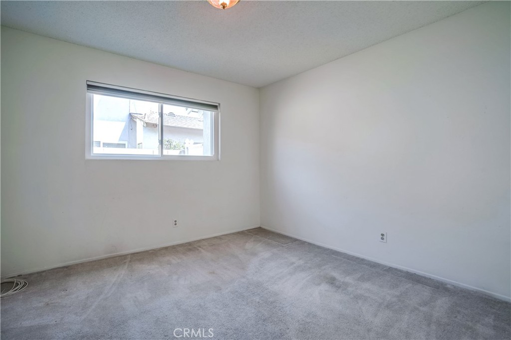 6473 Capistrano Way Riverside, CA 92504 - Photo 18 of 28 an empty room with a window