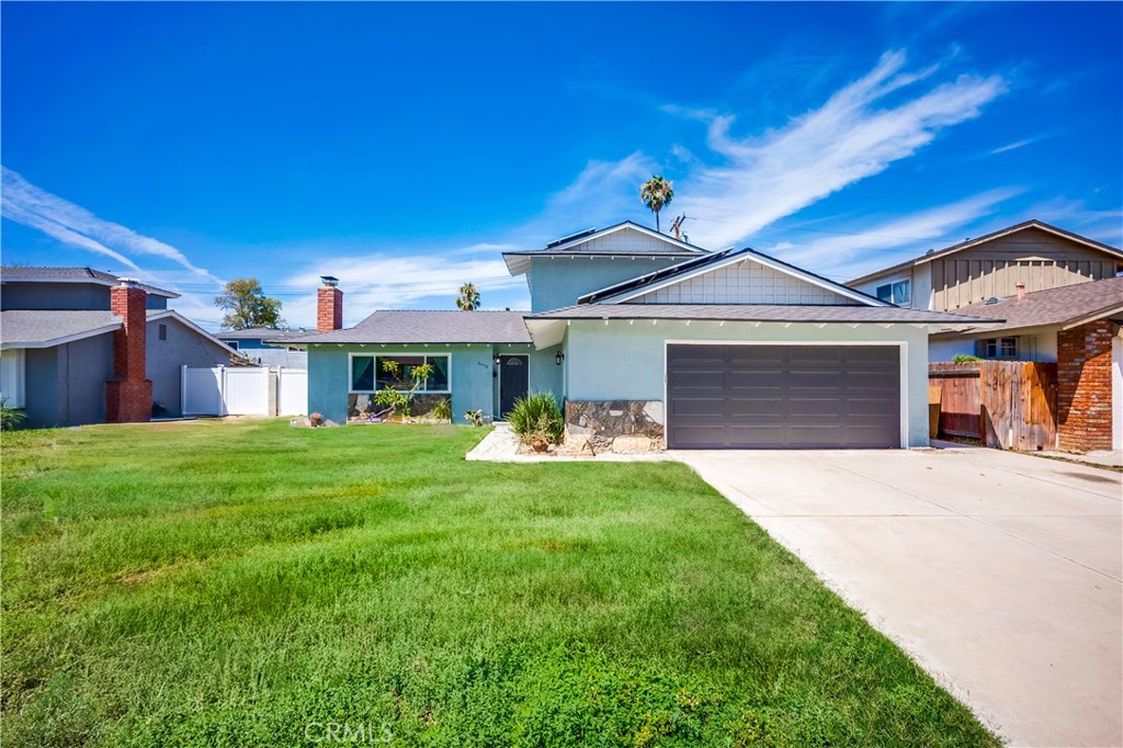 6473 Capistrano Way Riverside, CA 92504 - Photo 2 of 28 a front view of a house with a garden and porch