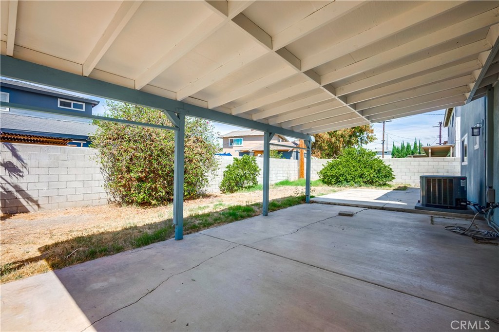 6473 Capistrano Way Riverside, CA 92504 - Photo 27 of 28 a view of backyard with plants and outdoor seating