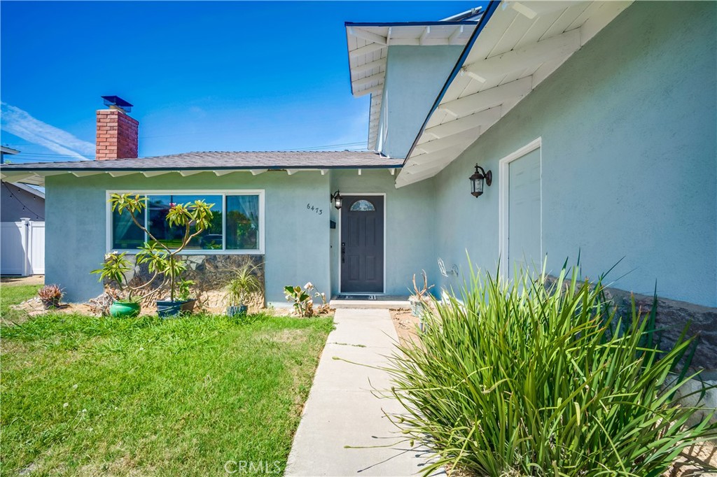 6473 Capistrano Way Riverside, CA 92504 - Photo 3 of 28 a front view of a house with garden