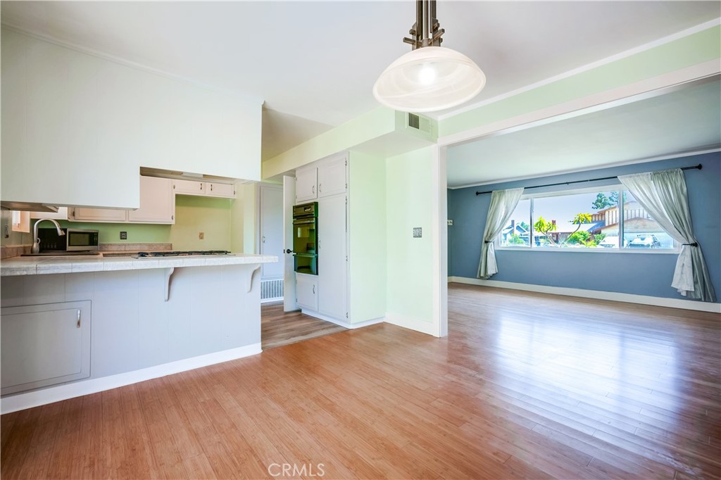 6473 Capistrano Way Riverside, CA 92504 - Photo 9 of 28 a kitchen with stainless steel appliances granite countertop a refrigerator and a stove top oven