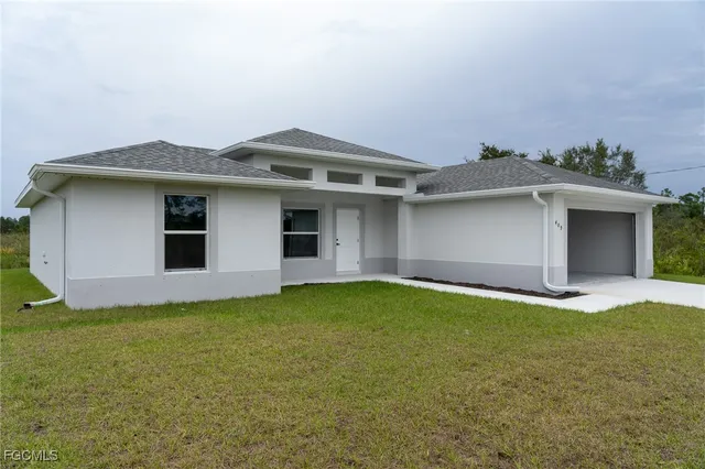 $1,600 | 409 Moore Avenue, Lehigh Acres, FL 33972
