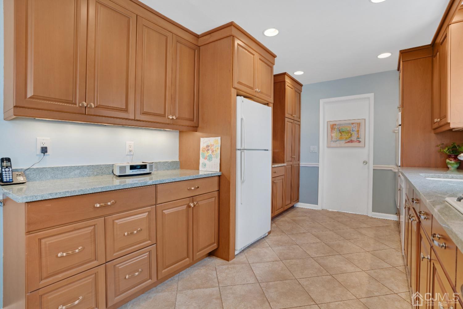 19 Warwick Road Edison, NJ 08820 - Photo 13 of 43 a kitchen with stainless steel appliances granite countertop a refrigerator and a sink
