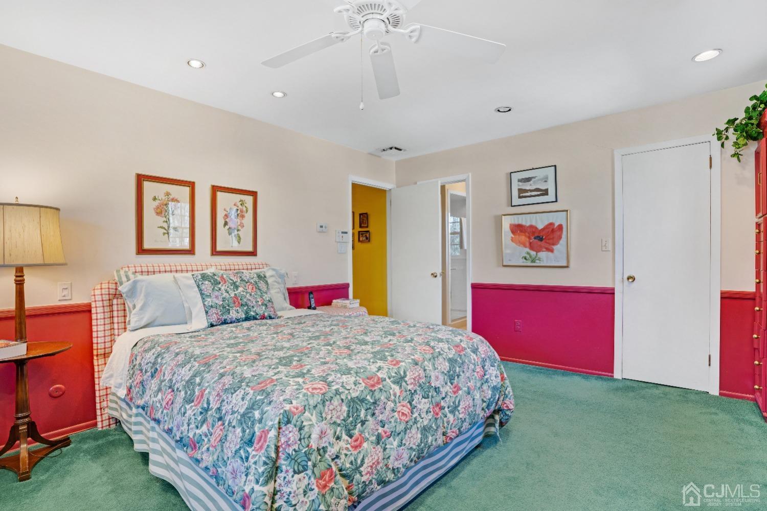 19 Warwick Road Edison, NJ 08820 - Photo 23 of 43 a bedroom with a bed and a chandelier