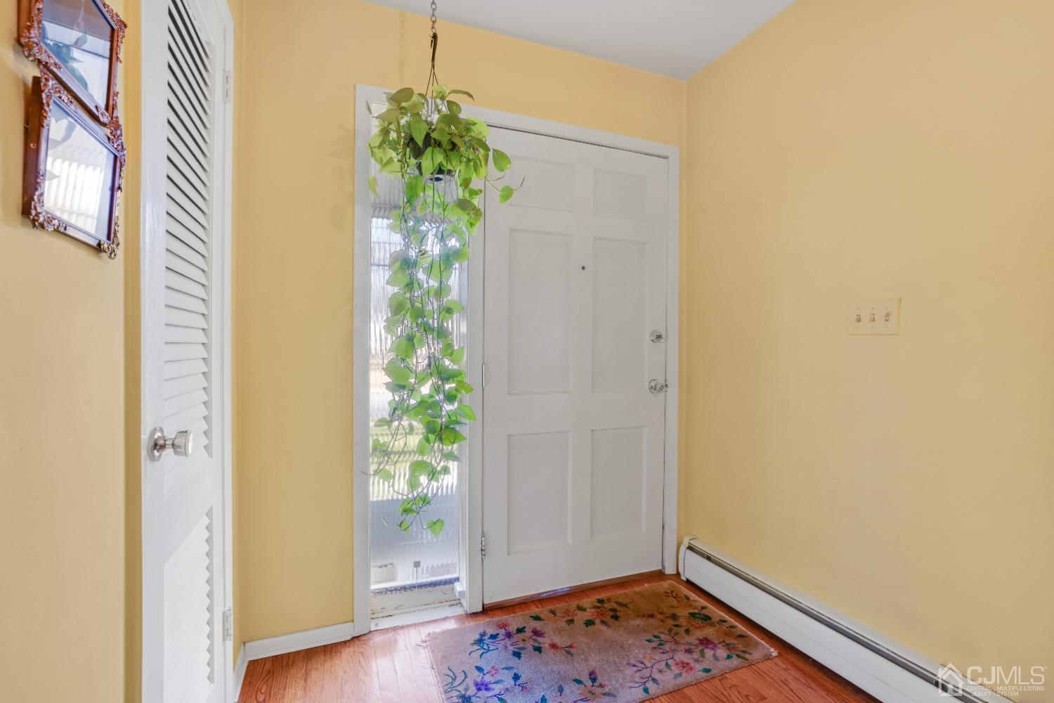 19 Warwick Road Edison, NJ 08820 - Photo 5 of 43 a view of an entryway with wooden floor