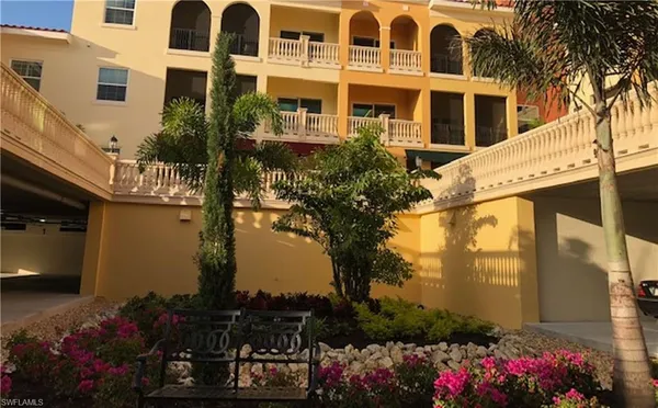 a front view of a building with flowers