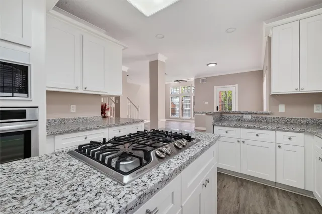 a kitchen with stove a sink and a stove
