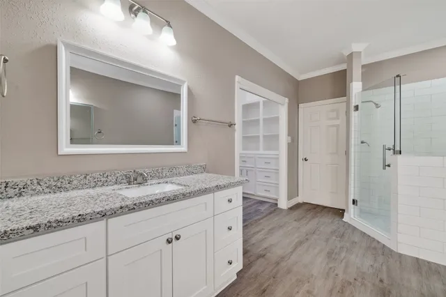 a spacious bathroom with a bathtub shower and sink