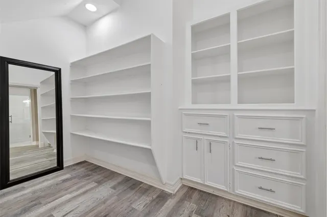 a view of an entryway with wooden floor