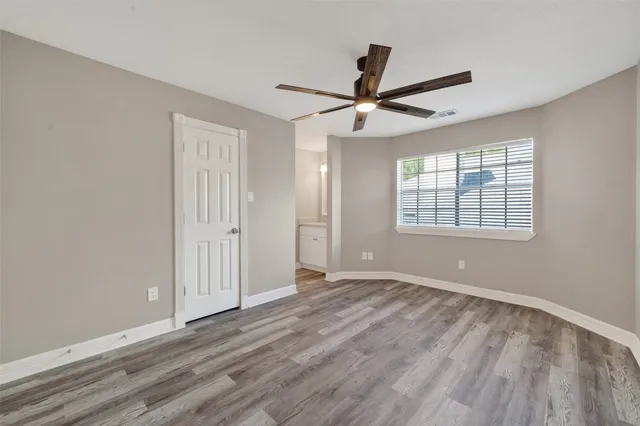 a view of livingroom with wooden floor and flat screen tv