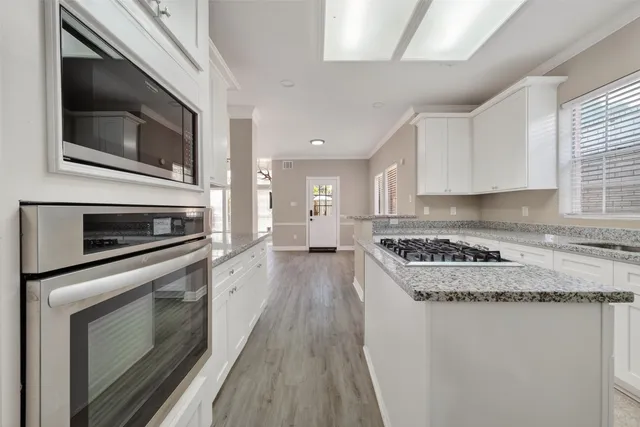 a kitchen with a stove and a microwave