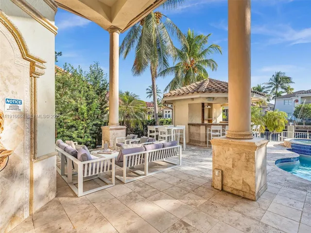 a view of a living room and chandelier