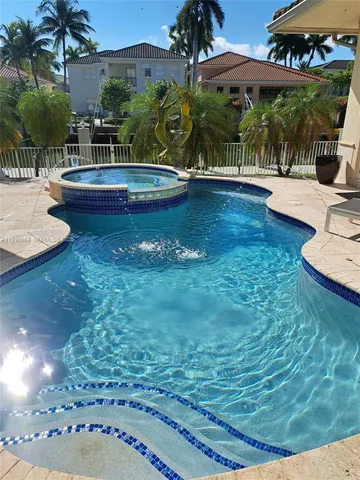 a view of a dining room with furniture and window