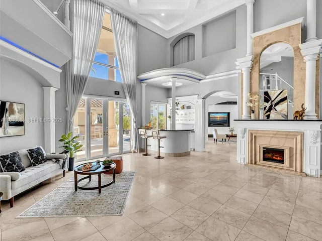 a view of a dining room with furniture and chandelier