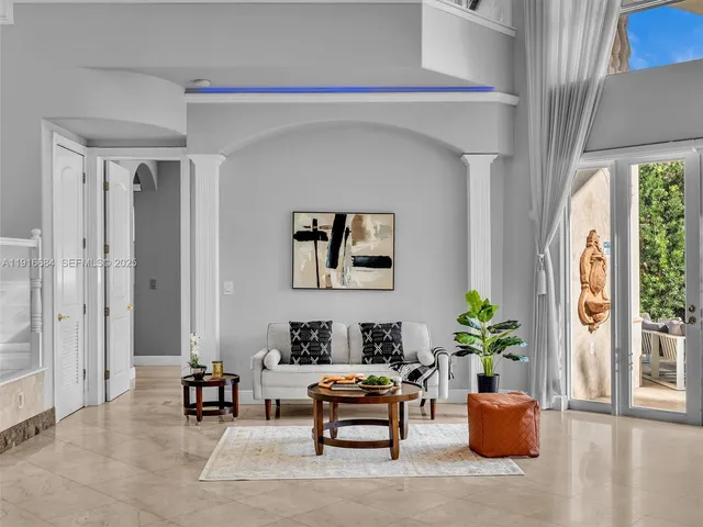 a view of a dining room with a table and chairs