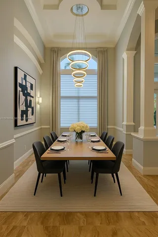 a kitchen with a sink and chairs